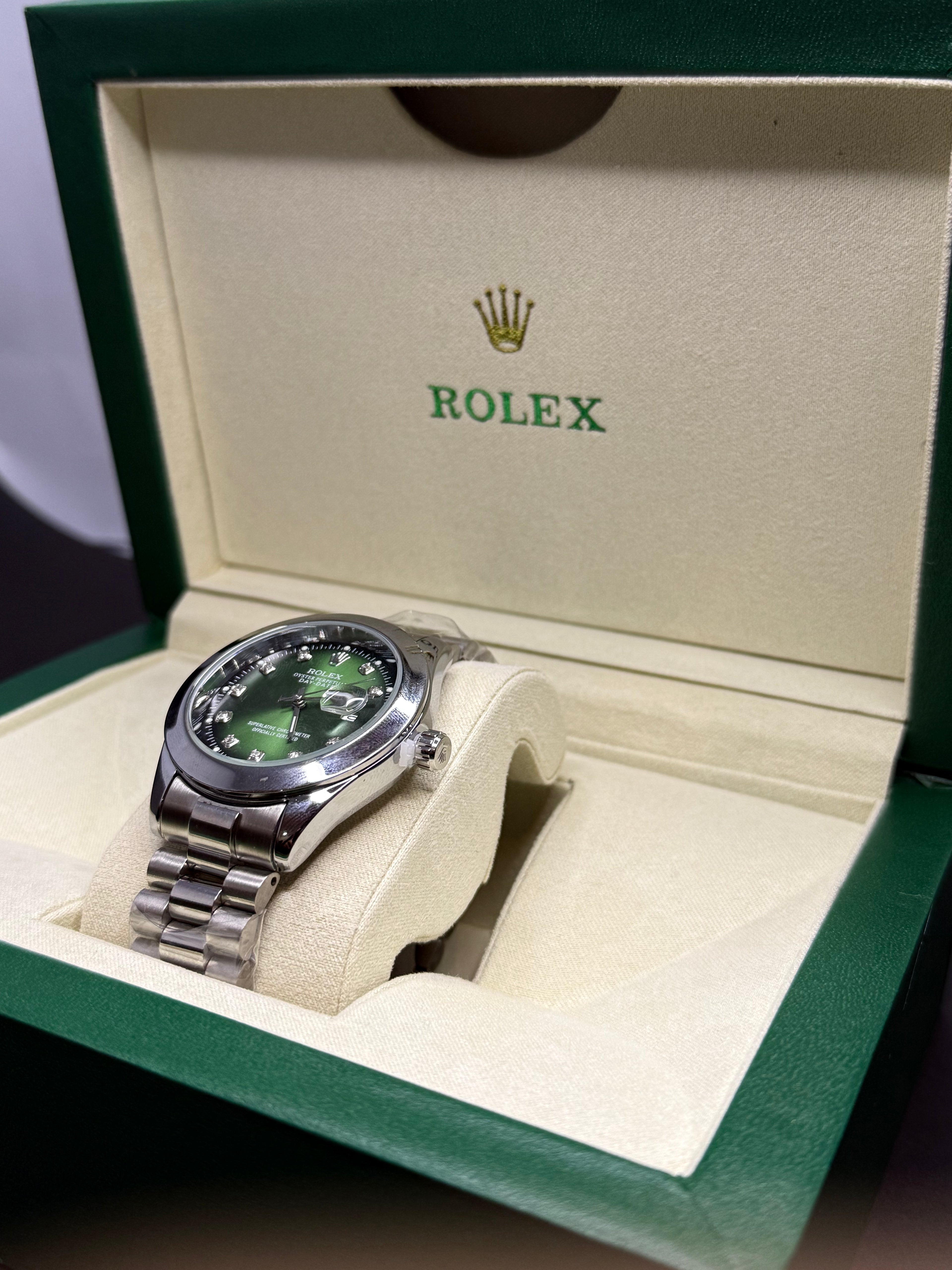 Luxury watch silver steel emerald green dial elegant timepiece Pakistan